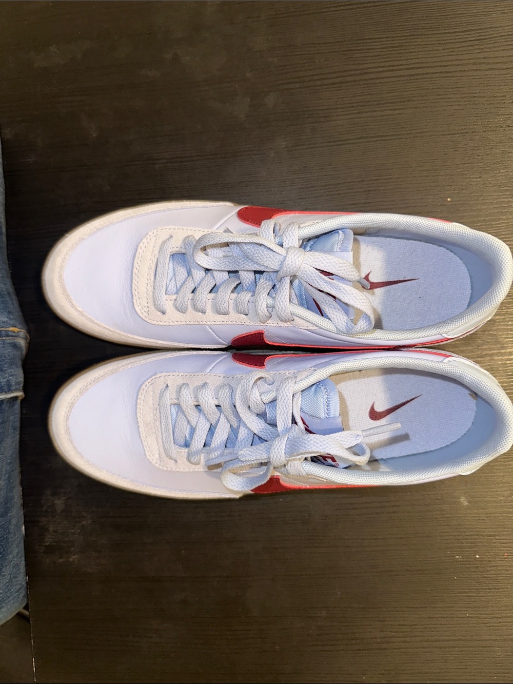 Nike White Sneakers with Red Swoosh Accents